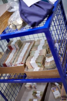 Carton boxes filled with sorted money photo