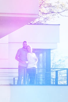 couple enjoying morning coffee on balcony photo