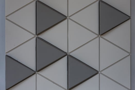 Gray mosaic background tiles. Closeup cleaning geometric mosaic   street wall texture background photo