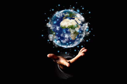 Environment concept. Earth in human hands on black background. Elements of this image furnished by NASA photo