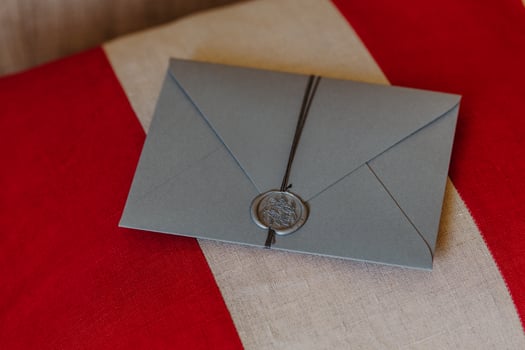 This envelope is for you. Wedding invitation card lies on red and white background. Decoration. Invitation concept. Correspondence photo