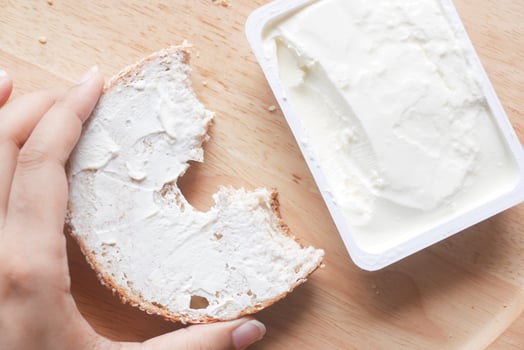 cheese cream spread on fresh bagel bread photo