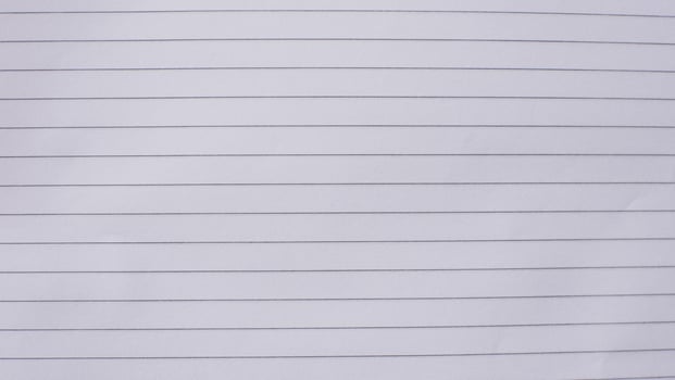 white sheet of paper. Lined notebook paper for background photo
