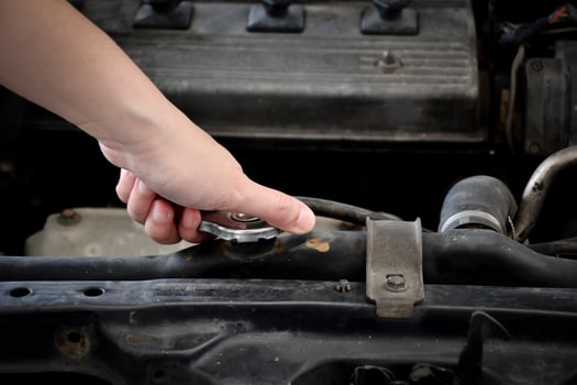 Women hand repairing Old car radiators parked in a garage. photo