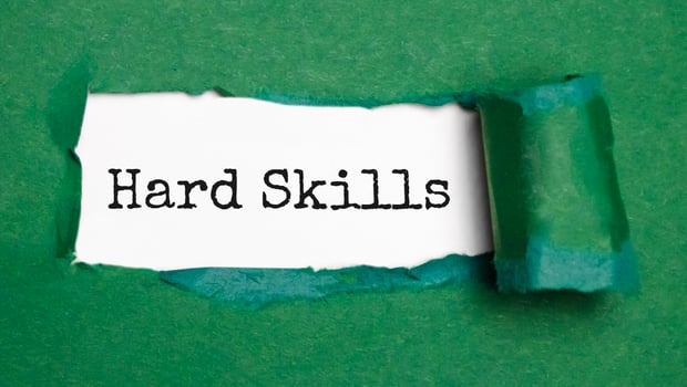 the word hard skills appearing behind torn white paper, photo