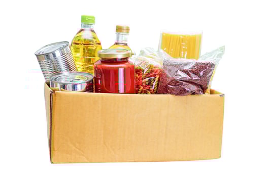 Foodstuffs in donation box for volunteer isolated on white background with clipping path. photo