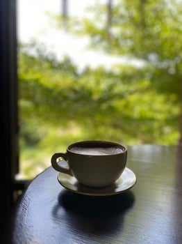 Hot coffee cup on table photo