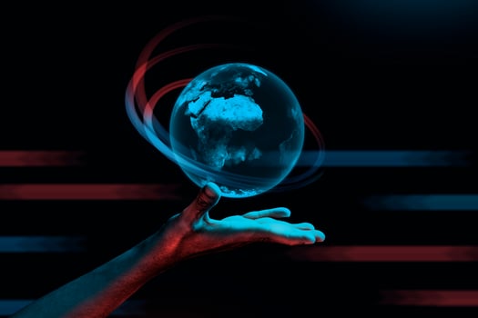Futuristic Earth Interface on hand on dark background photo