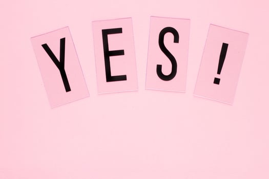 YES word plastic letters with copy space on pink background. Pastel concept for web, presentation, banners or motivation. Top view image photo