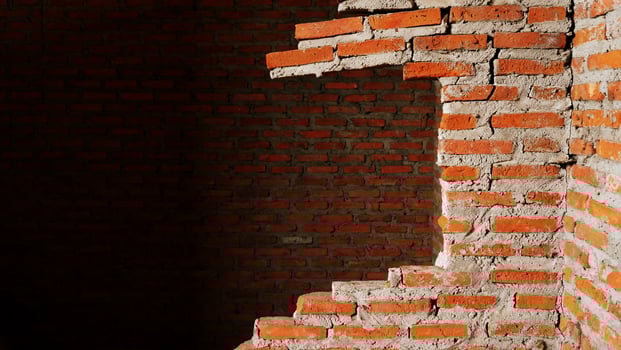 Close-up of the rubble of an industrial building collapsing into a pile of concrete and brick. and the jagged debris caused by the failure of the engineers at the abandoned construction. photo