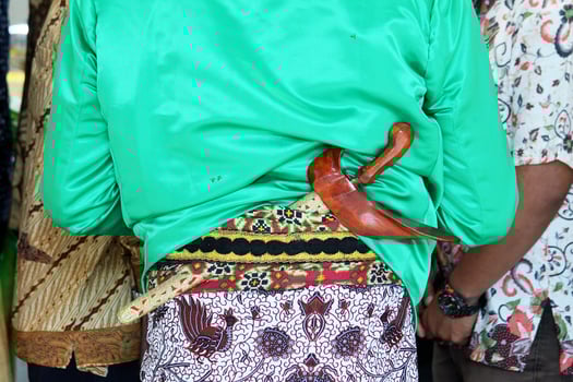 Beskap is an Indonesian traditional dress for the Javanese people. Keris is a traditional Javanese weapon that is usually tucked in a beskap. Usually used for traditional events such as weddings. photo