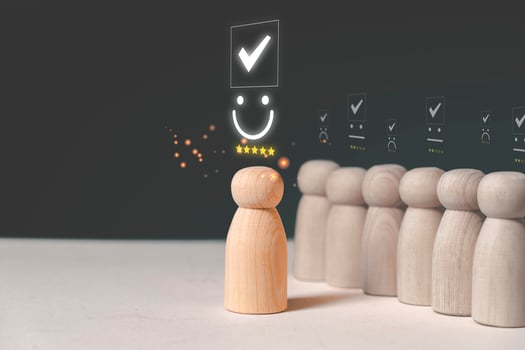 Wooden doll with emotion face and yellow stars for customer evaluation and satisfaction for product and service photo