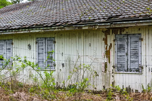 Broken destroyed old house in forest Germany. photo