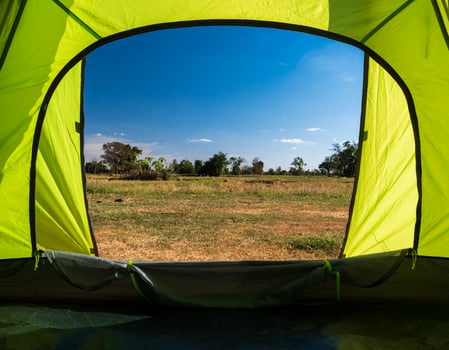 Traveler green tent Camping outdoor travel. View from tent inside see viewpoint a high mountain from a distance in summer landscape. during evening day suitable for sleeping and resting the body photo