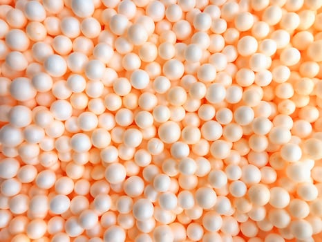 Background of white circle styrofoam ball pattern texture foam surface abstract background photo