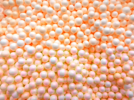 Background of white circle styrofoam ball pattern texture foam surface abstract background photo