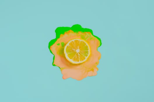 Slice lemon on colorful poster color photo