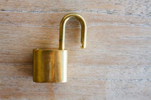 Golden padlock on wood background photo