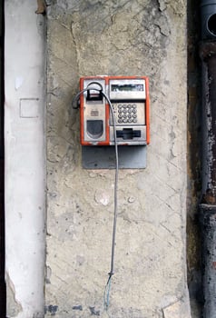 Lost connection - damaged old pay telephone photo