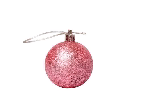 New Year concept. Toy with glitter layer pink on Christmas tree isolate on white. photo