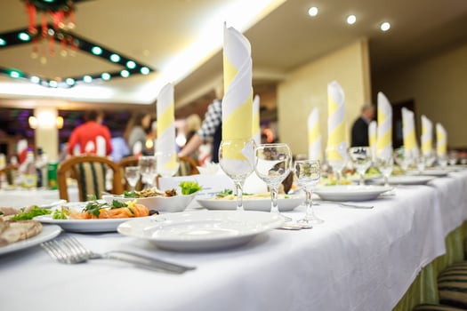 View of the served for decorated wedding dinner table. photo