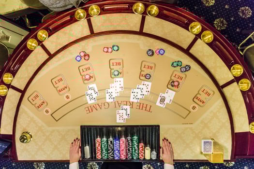 gambling chips and cards on a game table roulette photo