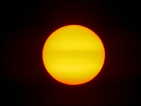 Sunspot on sun photosphere dark background photo