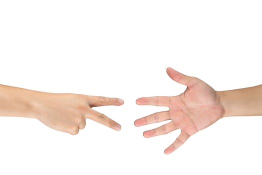 Rock Paper Scissors gambling hand game for all of ages and sex. This is Asian male hands post on white background. photo