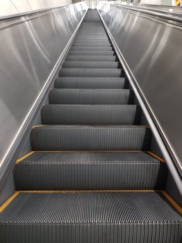 Modern escalator and staircase in subway station photo