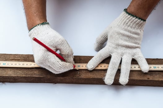 Male hands with ruler and pencil closeup photo