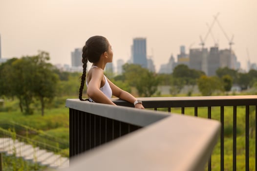 Portrait of young fitness woman in sportswear in city park, Healthy and Lifestyles. photo