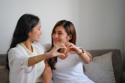 lgbtq, lgbt concept, homosexuality, two beautiful women showing their love to each other in a very warm home happily photo