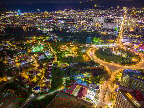 Panoramic coastal Vung Tau view from above, with traffic roundabout, house, Vietnam war memorial in Vietnam. Long exposure photography at night. photo
