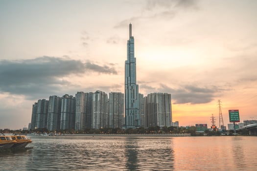 Ho Chi Minh city, Vietnam, FEB 11 2022 sunset view at Landmark 81 - it is a super tall skyscraper and Saigon bridge with development buildings along Saigon river light smooth down photo