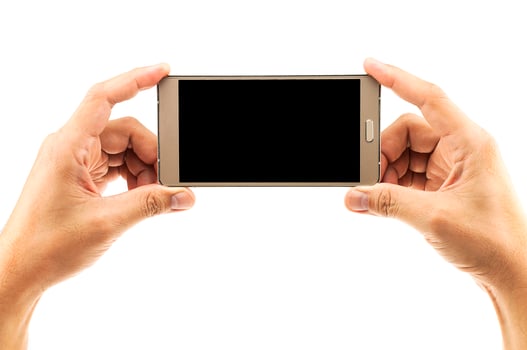 Isolated male hands holding and pushing home button of white blank screen smart mobile phone. photo