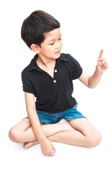 Isolated of sitting boy looking at his index finger photo