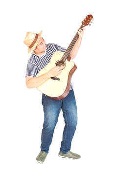 14 years Asian boy is happily playing guitar isolated over white photo