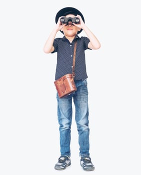 Vintage photo of 7 years old Asian traveler boy is using binoculars