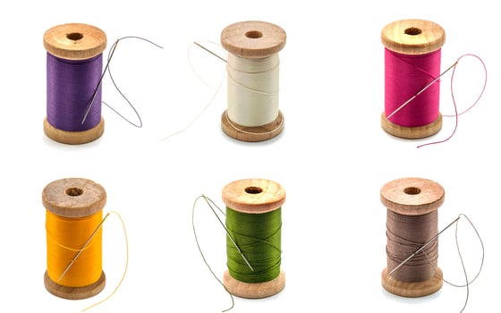 Collage of isolated wooden spool thread and needle photo