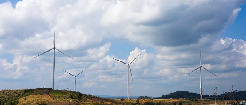 Offshore wind power and energy farm with many wind turbines on the mountain photo