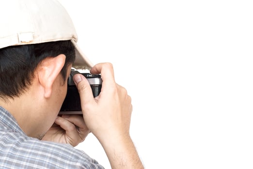 Man holding film camera ready to take photo over white background