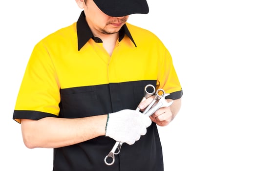 Mechanic man isolated over white photo