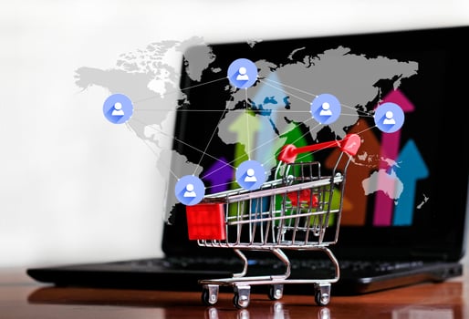 Success in Online Shopping - Trolley and Laptop photo