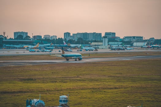 Ho Chi Minh city, Vietnam - FEB 12 2022 Airplane fly over urban areas preparing landing into Tan Son Nhat International Airport and takes off in TSN airport photo