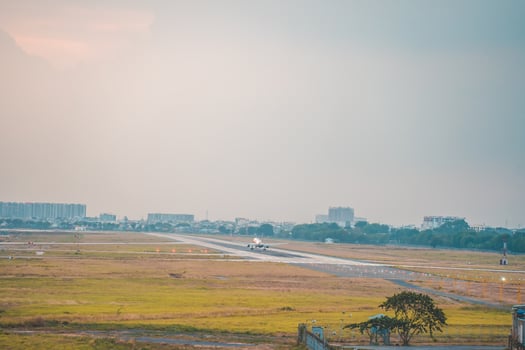 Ho Chi Minh city, Vietnam - FEB 12 2022 Airplane fly over urban areas preparing landing into Tan Son Nhat International Airport and takes off in TSN airport photo
