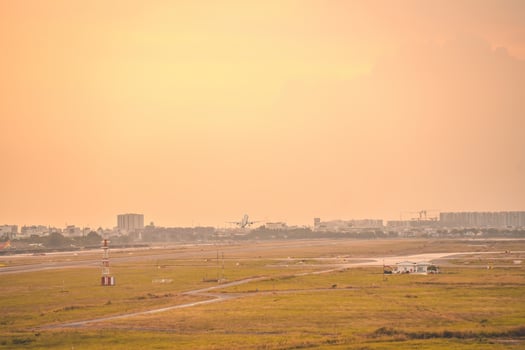 Ho Chi Minh city, Vietnam - FEB 12 2022 Airplane fly over urban areas preparing landing into Tan Son Nhat International Airport and takes off in TSN airport photo