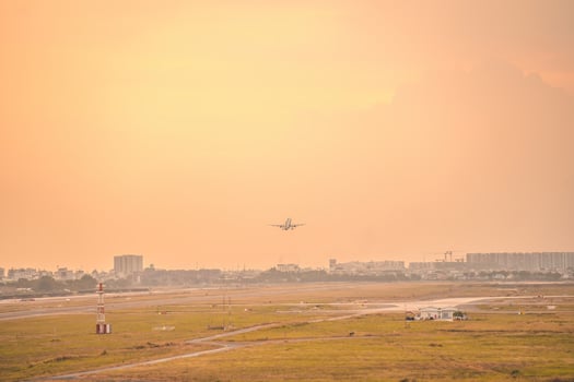 Ho Chi Minh city, Vietnam - FEB 12 2022 Airplane fly over urban areas preparing landing into Tan Son Nhat International Airport and takes off in TSN airport photo
