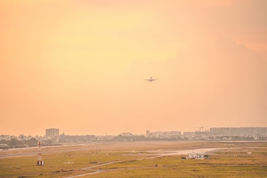 Ho Chi Minh city, Vietnam - FEB 12 2022 Airplane fly over urban areas preparing landing into Tan Son Nhat International Airport and takes off in TSN airport photo
