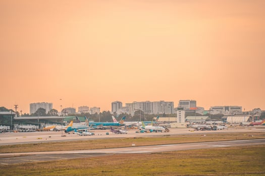 Ho Chi Minh city, Vietnam - FEB 12 2022 Airplane fly over urban areas preparing landing into Tan Son Nhat International Airport and takes off in TSN airport photo