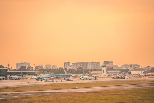 Ho Chi Minh city, Vietnam - FEB 12 2022 Airplane fly over urban areas preparing landing into Tan Son Nhat International Airport and takes off in TSN airport photo